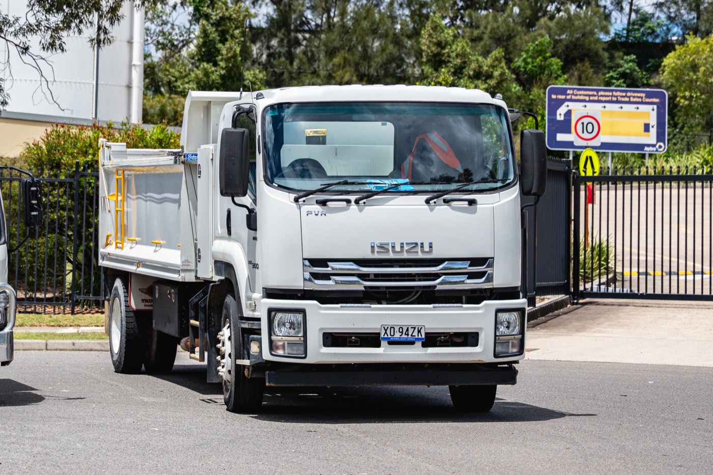 Clean white Isuzu tipper truck after a fleet wash
