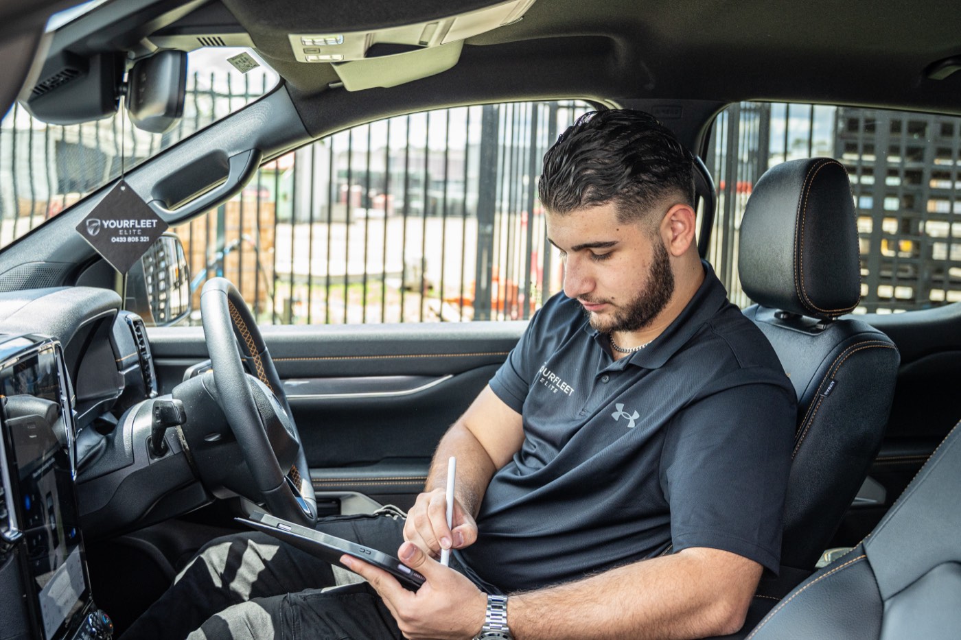 Reviewing fleet tracking data on a tablet in a vehicle cab