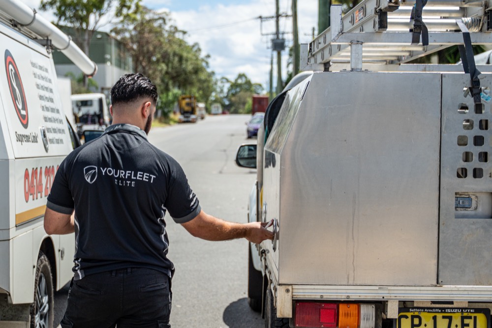 Checking a service ute tray and toolboxes during a fleet inspection